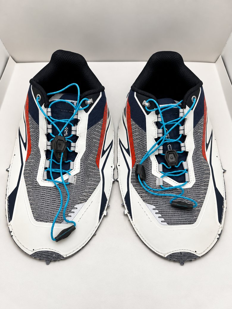 White and navy runner upper with blue toggle laces