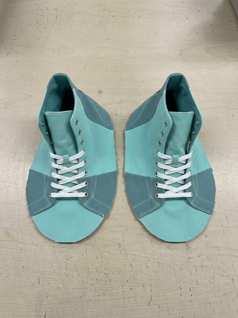 Teal mesh high-top upper with white laces